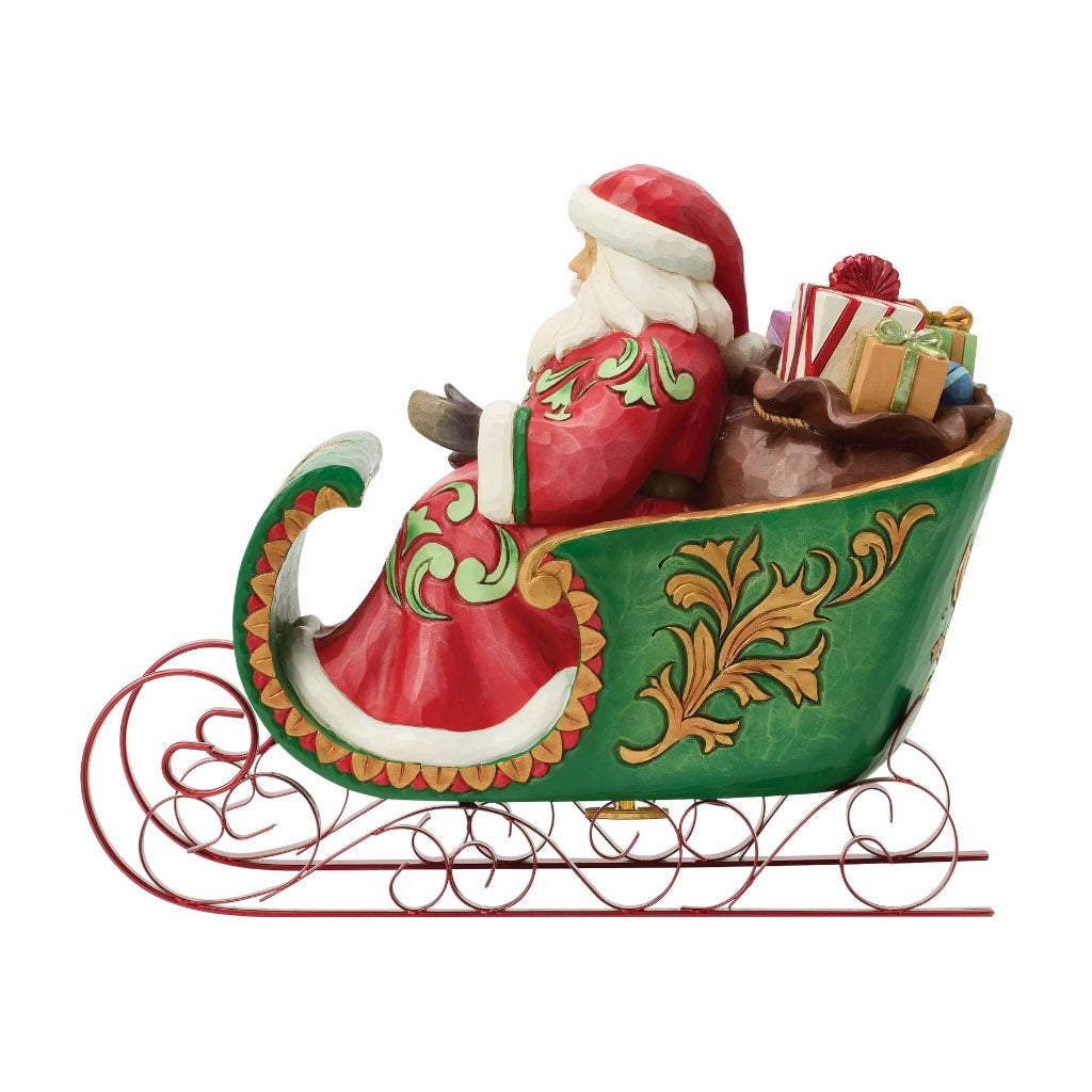 Jim Shore Santa Riding A Musical Sleigh Figurine
